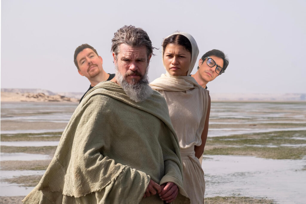 The odyssey Matt Damon and Zendaya are interurpted on the beach by two podcasters, Iain (left) and Gavin (right )
